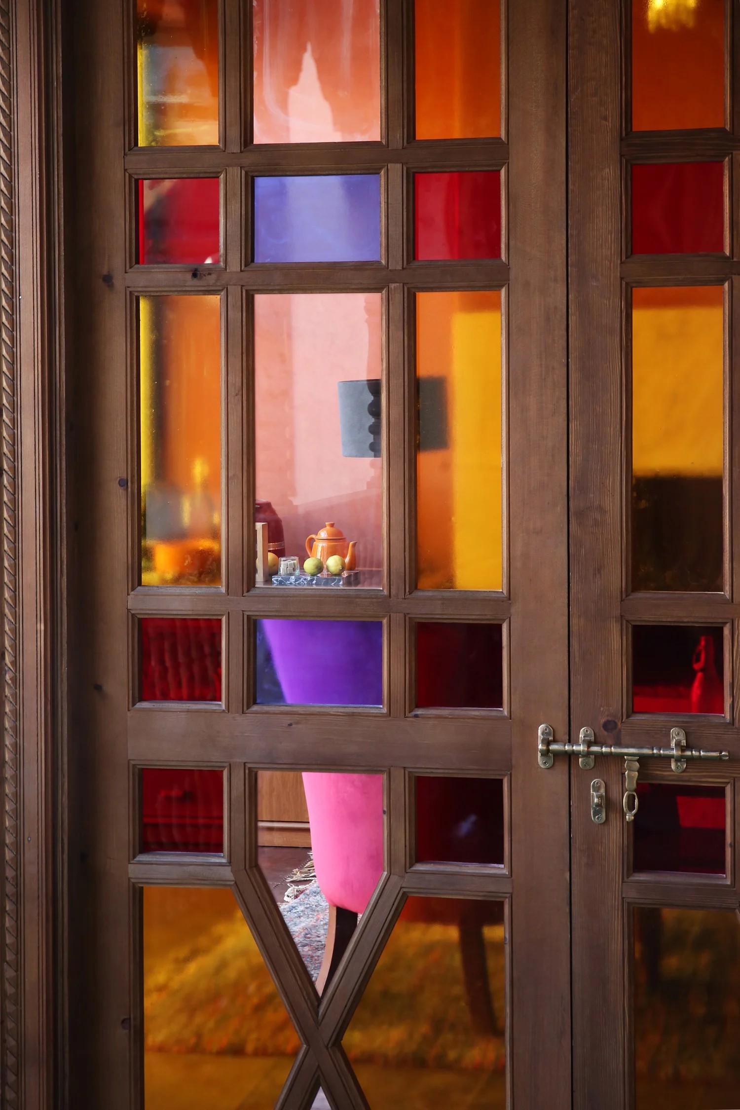 A colorful Moroccan riad has been transformed into a kaleidoscope of patterned textiles, striking artwork, and eye-catching tiles.