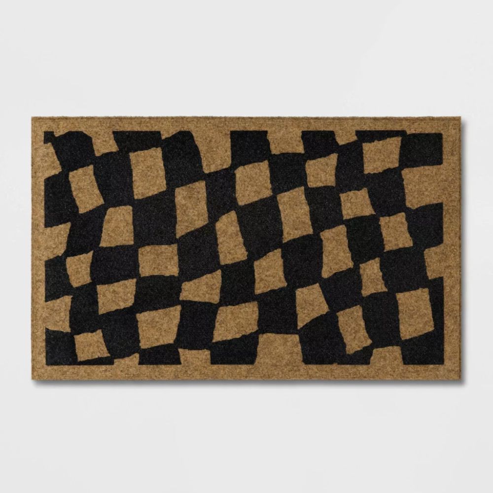 Chequered black and neutral doormat