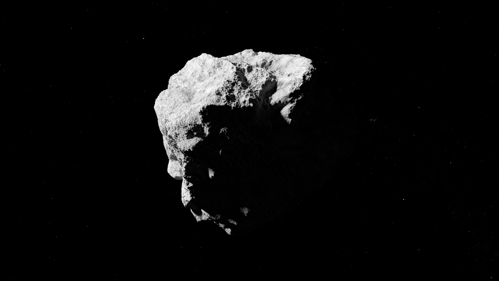 A rocky asteroid is pictured against the black of space.