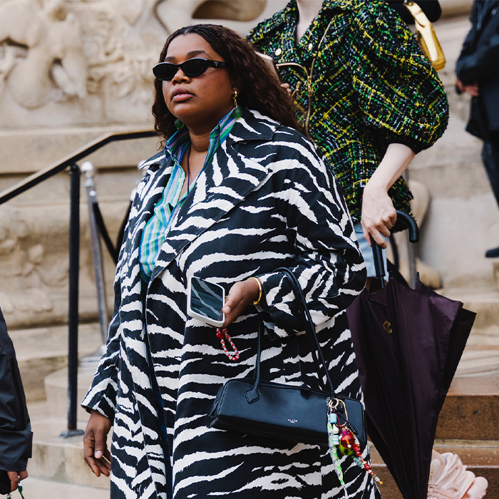 Gabriella wears zebra coat, jeans, two-toned heels and a black Alaia bag. 