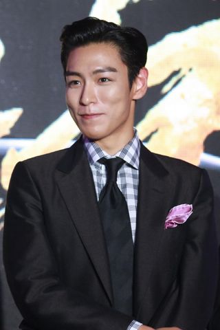 South Korean singer T.O.P (aka Choi Seung-hyun) attends the press conference of film "Out of Control" during the 19th Shanghai International Film Festival on June 14, 2016 in Shanghai, China.