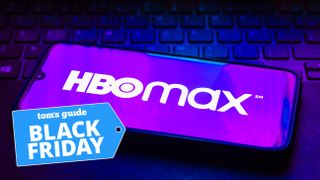 The HBO Max logo is on a phone, and there's a Tom's Guide Black Friday deal tag in the bottom left corner of the image.