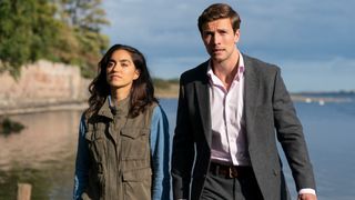 Detectives Havers and Lynley stand in front of a river