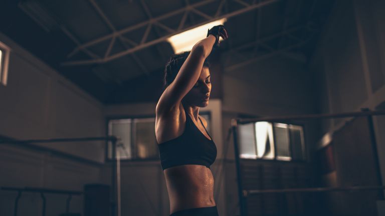 Woman sweating after burpee workout