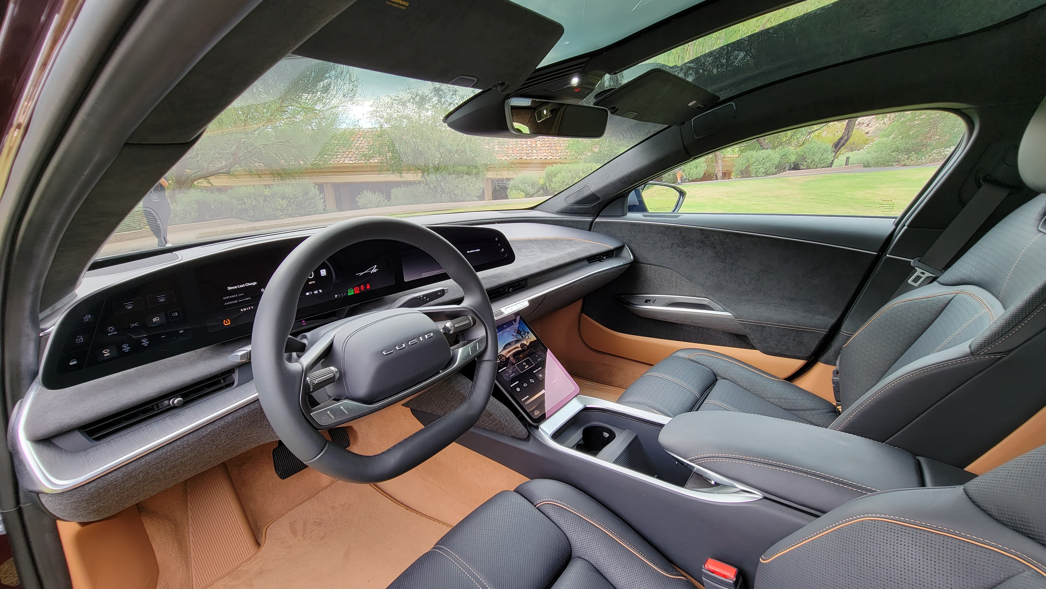 Inside the cabin, showing front seats and dash