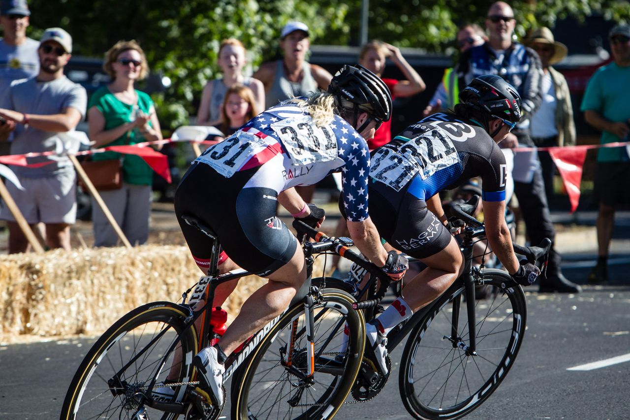 Riders take the tight third turn on the Cascade Cycling Classic criterium course.