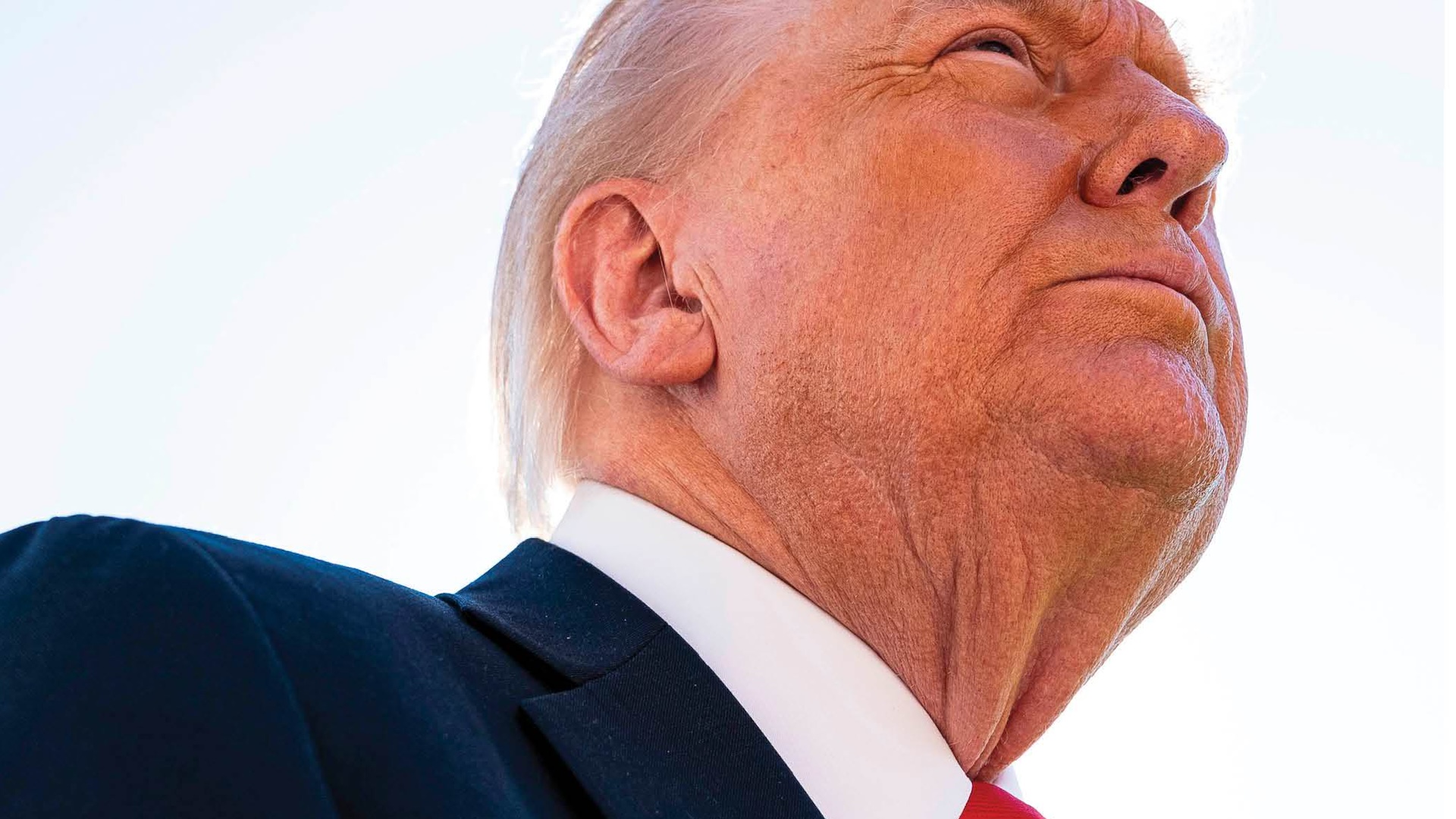 Unflattering photo of Donald Trump taken from a low angle 