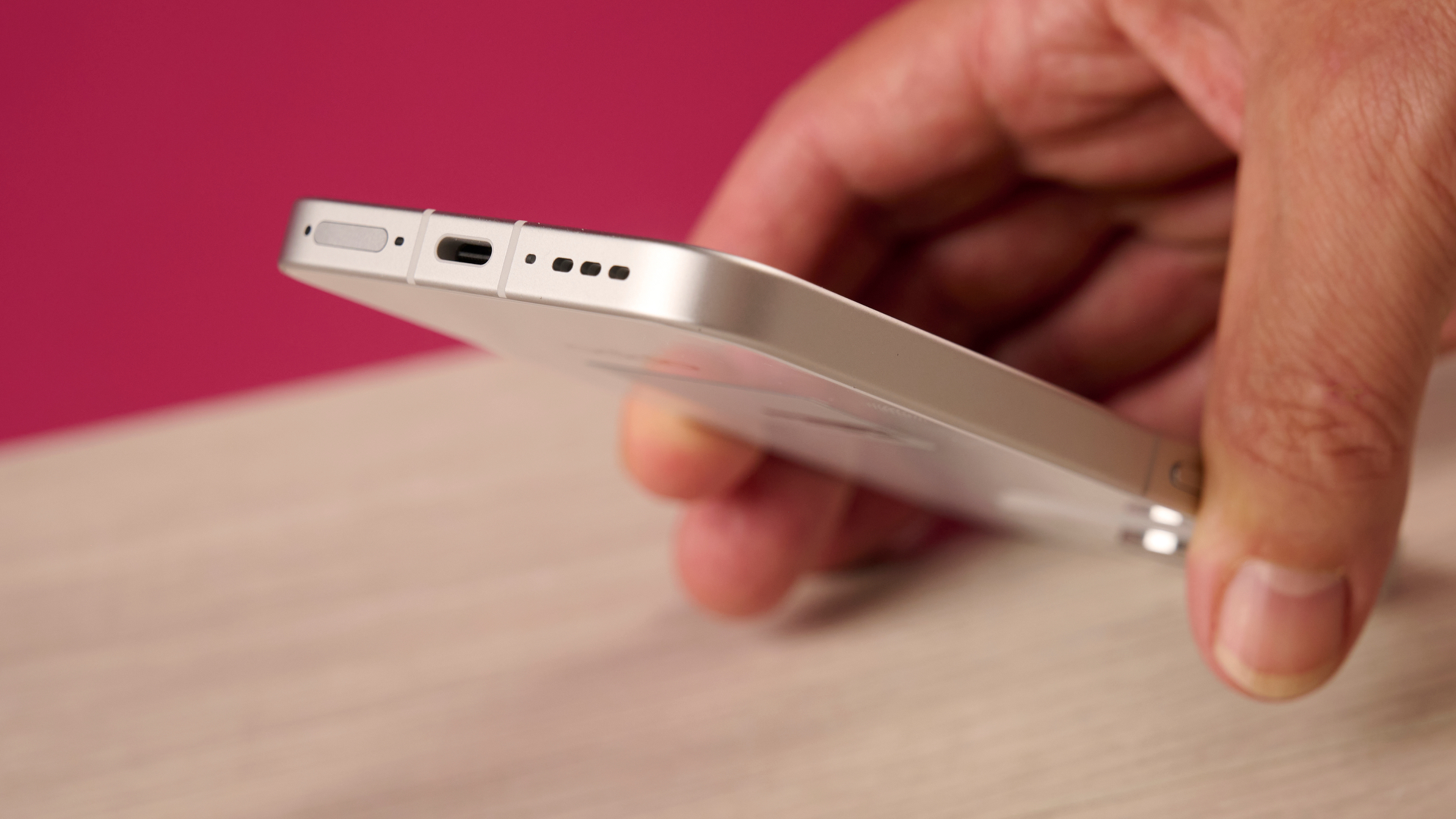 Man holding the Oppo Reno 16 5G