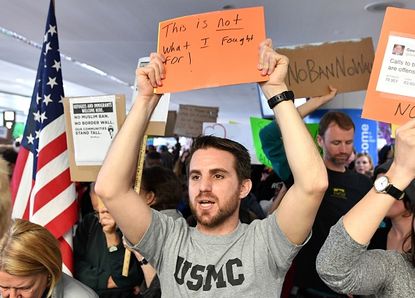 Iraq War veteran Evan Cohen protests at San Francisco Airport on Sunday.