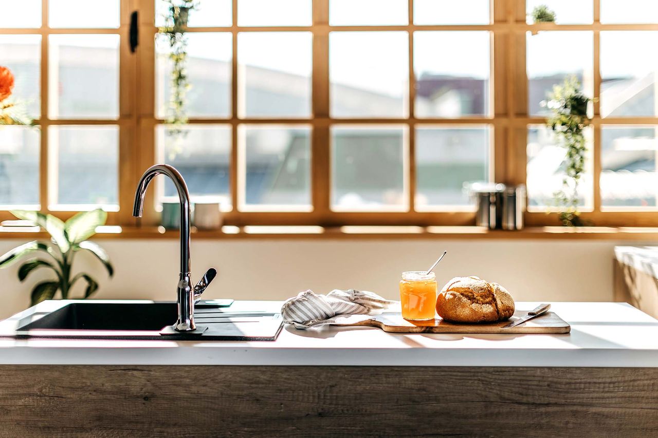 one of the best kitchen faucets on display in the kitchen next to food