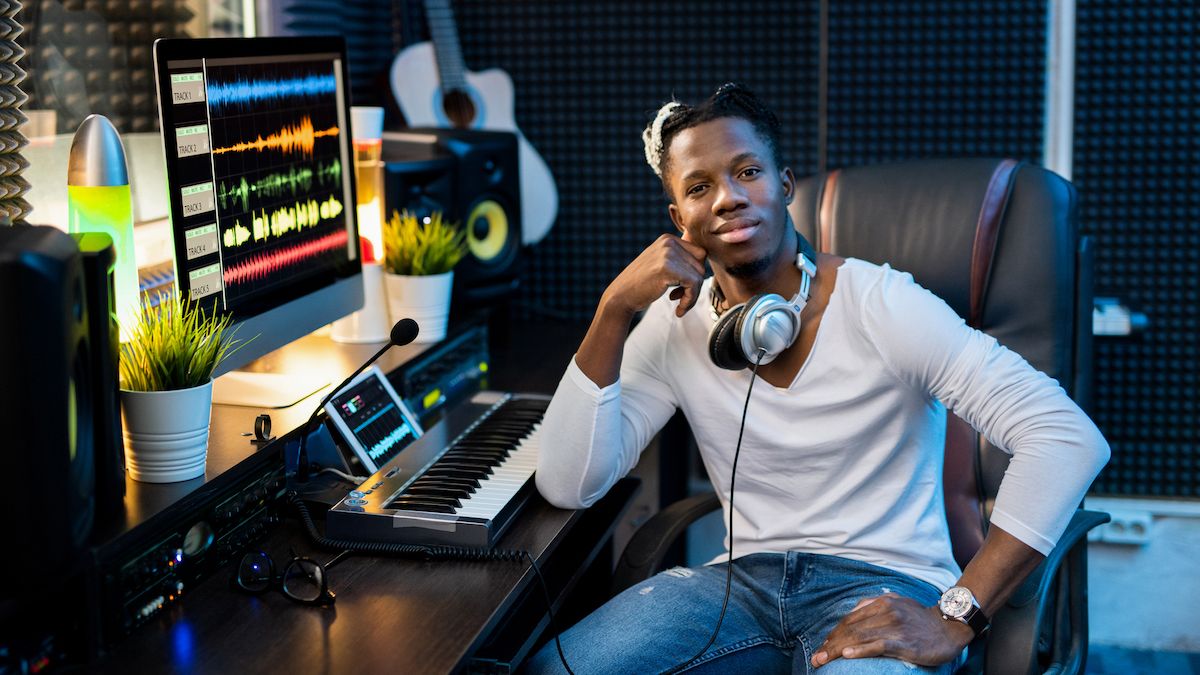 Man sits in his home recording studio