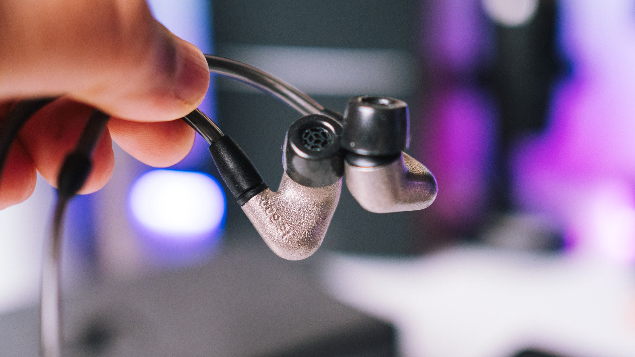In-hand view of the Sennheiser IE600 with the connector