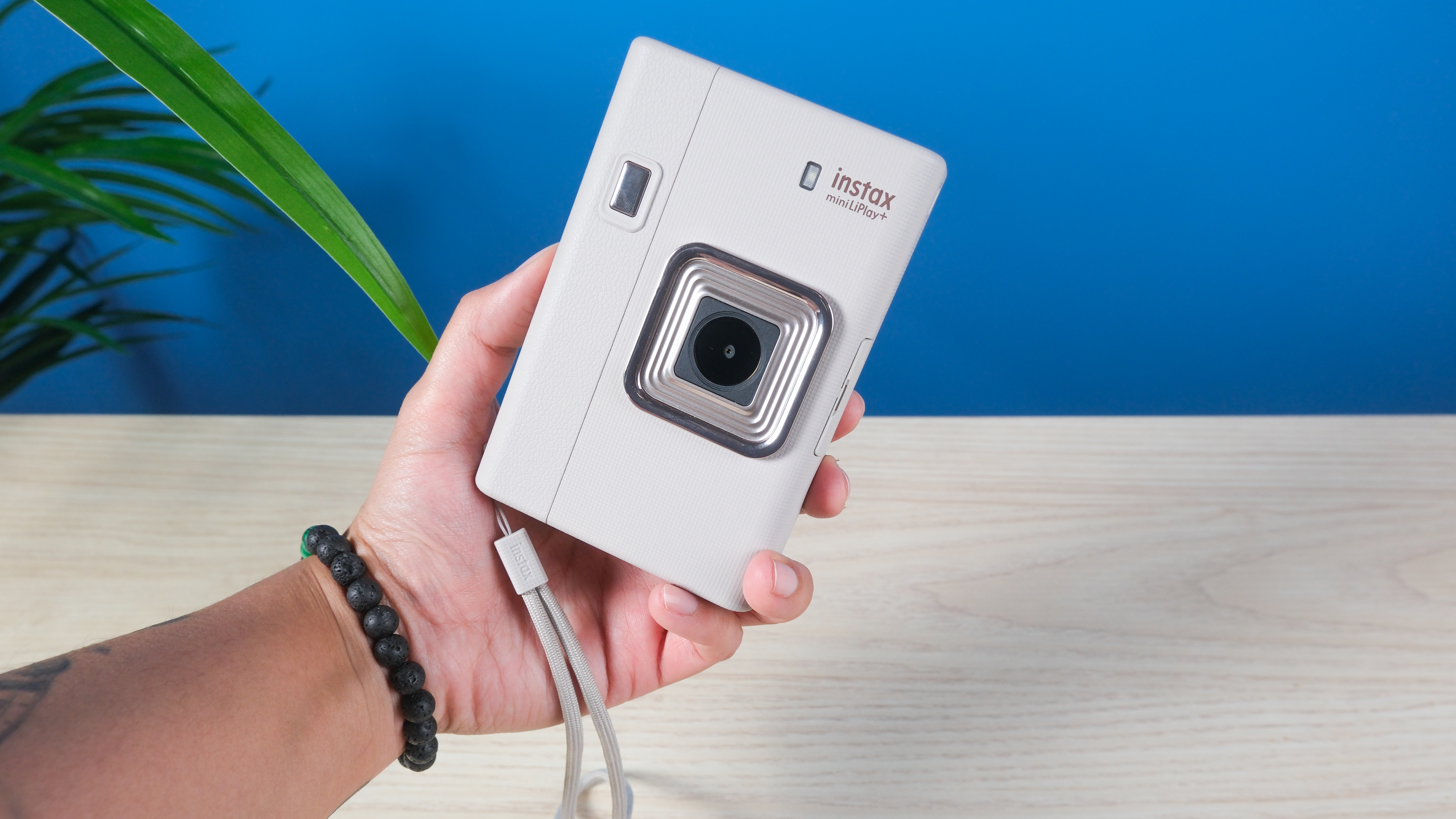 A Sand Beige Fujifilm Instax mini LiPlay Plus hybrid instant camera