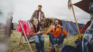 Campers chilling in their chairs at a festival