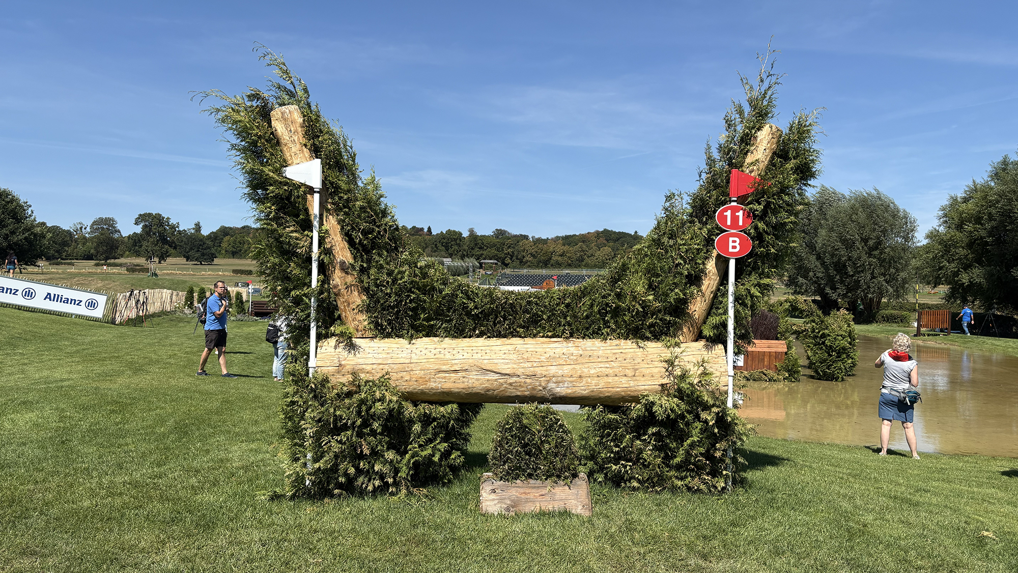 A brush fence with water behind on the eventing World Championships cross-country course