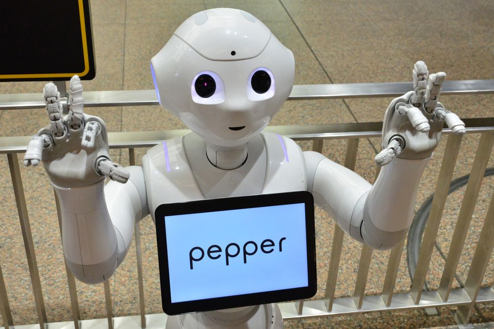 Pepper the robot with hands up