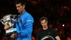 Andy Murray of Great Britain looks on as Novak Djokovic of Serbia 