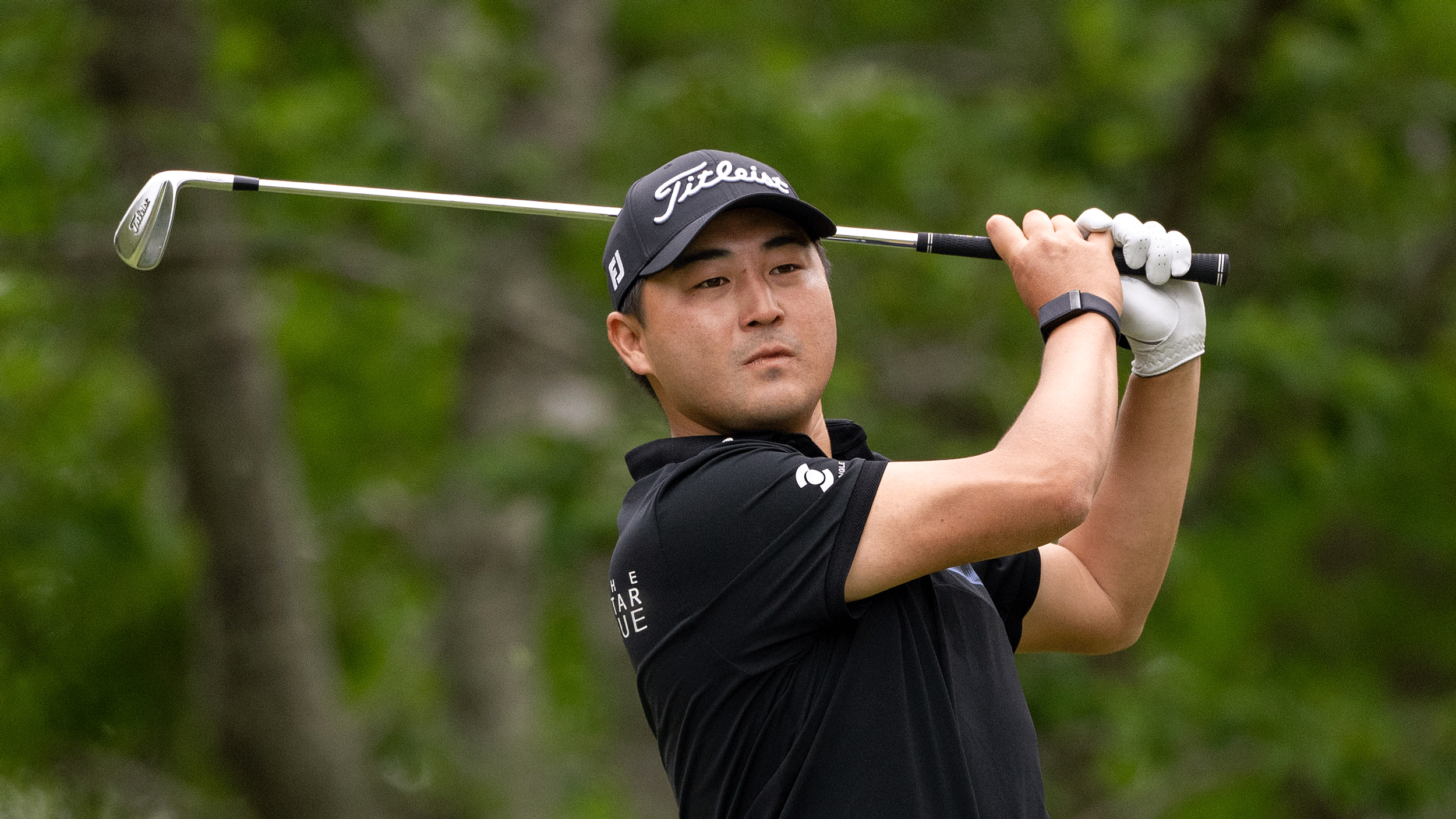 Richard T Lee hits an iron shot at the 2025 International Series Japan