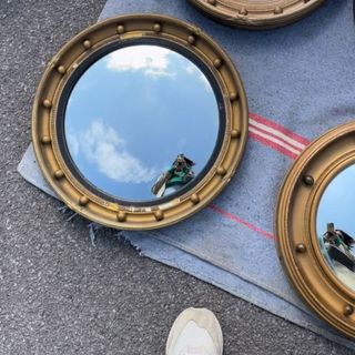 A set of round gilded mirrors at the Sunbury Antiques Market