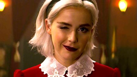 Best shows on Netflix: Kiernan Shipka as Sabrina Spellman winking during the series, The Chilling Adventures of Sabrina.