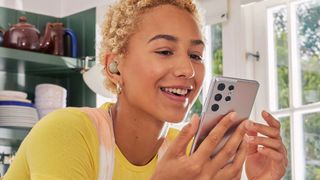 Samsung Galaxy Buds2 Review: image shows woman wearing Samsung Galaxy Buds2 earbuds