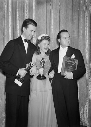 (L-R) James Stewart, Ginger Rogers, and comedian Bob Hope after winning their movie awards at the 1941 Academy Awards in California