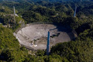 This aerial view shows the damage at the Arecibo Observatory after one of the main cables holding the receiver broke in Arecibo, Puerto Rico, on December 1, 2020.