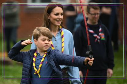 Kate Middleton and Prince George scouts visit with George having a go at archery as Kate looks on