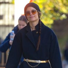 Katie Holmes wears a beanie and a jacket