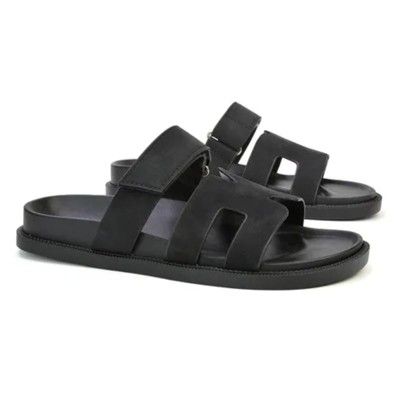black sandals that are a lookalike for the Hermes Oran Sandal 