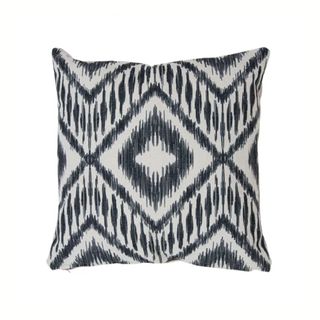A blue and white Ikat outdoor cushion