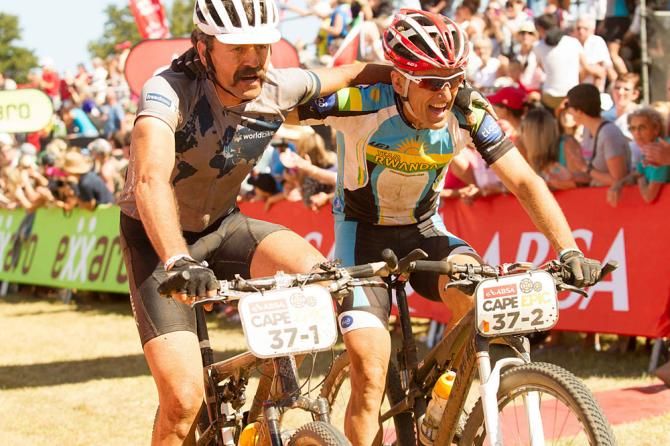 Tom Ritchey (left) and Alex Stieda (right) cross the finish line of the final stage