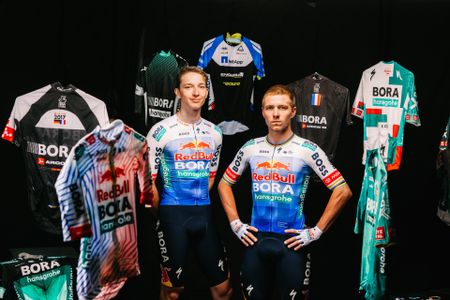 Red Bull Bora Hansgrohe kit for the 2026 Tour de France, featuring a blue gradient on a white jersey with black shorts