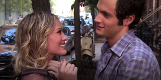 Hilary Duff as Olivia Burke stands with Dan Humphrey on a sidewalk in Gossip Girl