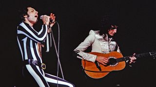 Freddie Mercury (left) and Brian May of Queen perform live at The Oakland Coliseum in 1977 in Oakland, California. 