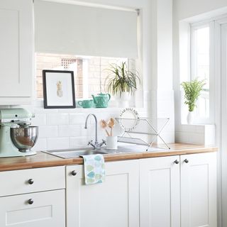 kitchen with white wall and cabinet