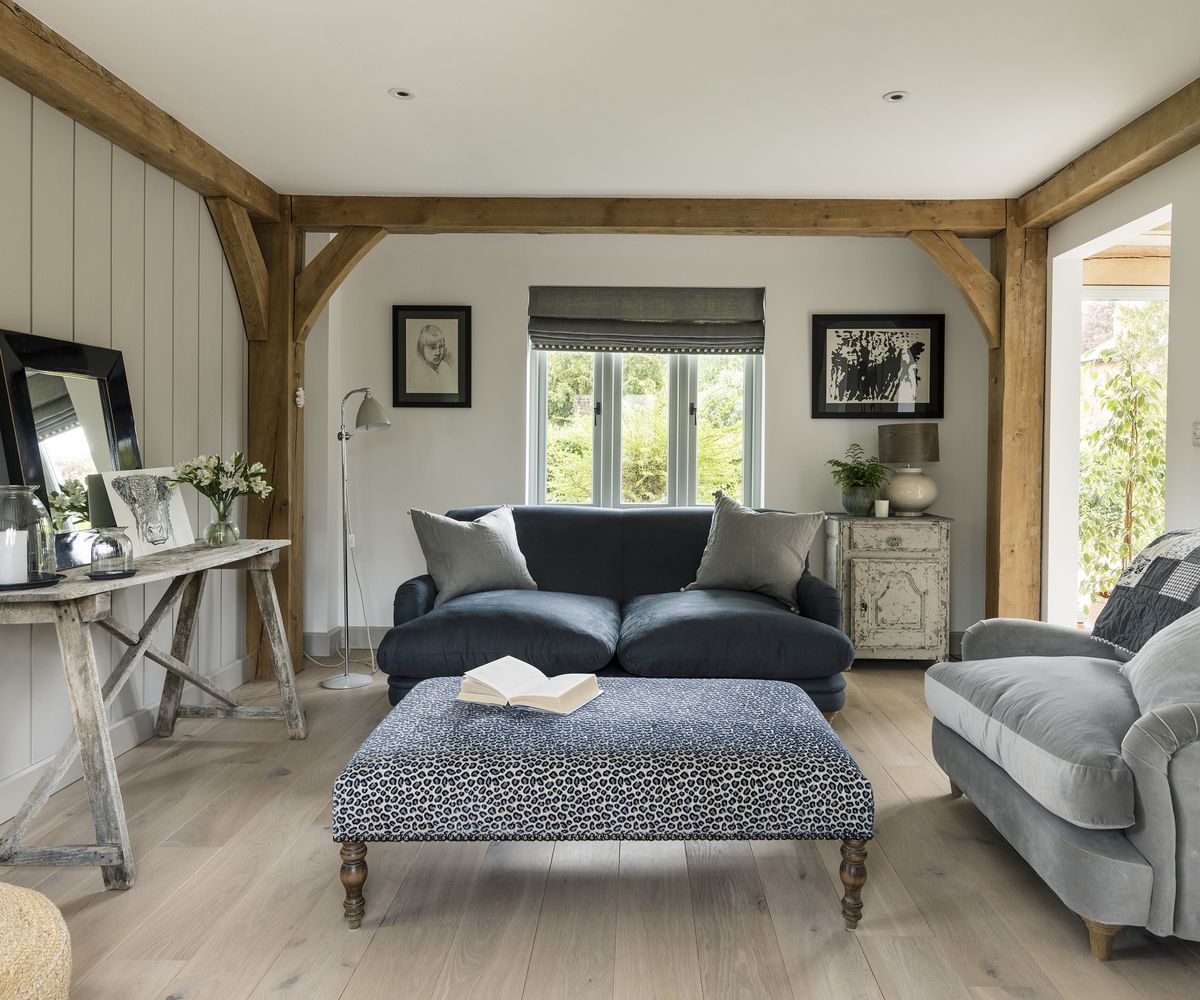 Rustic living room with neutral palette and exposed oak beams