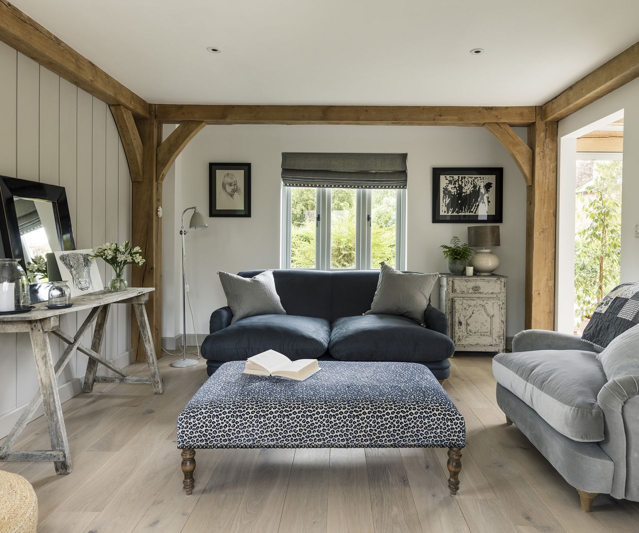 Rustic living room with neutral palette and exposed oak beams
