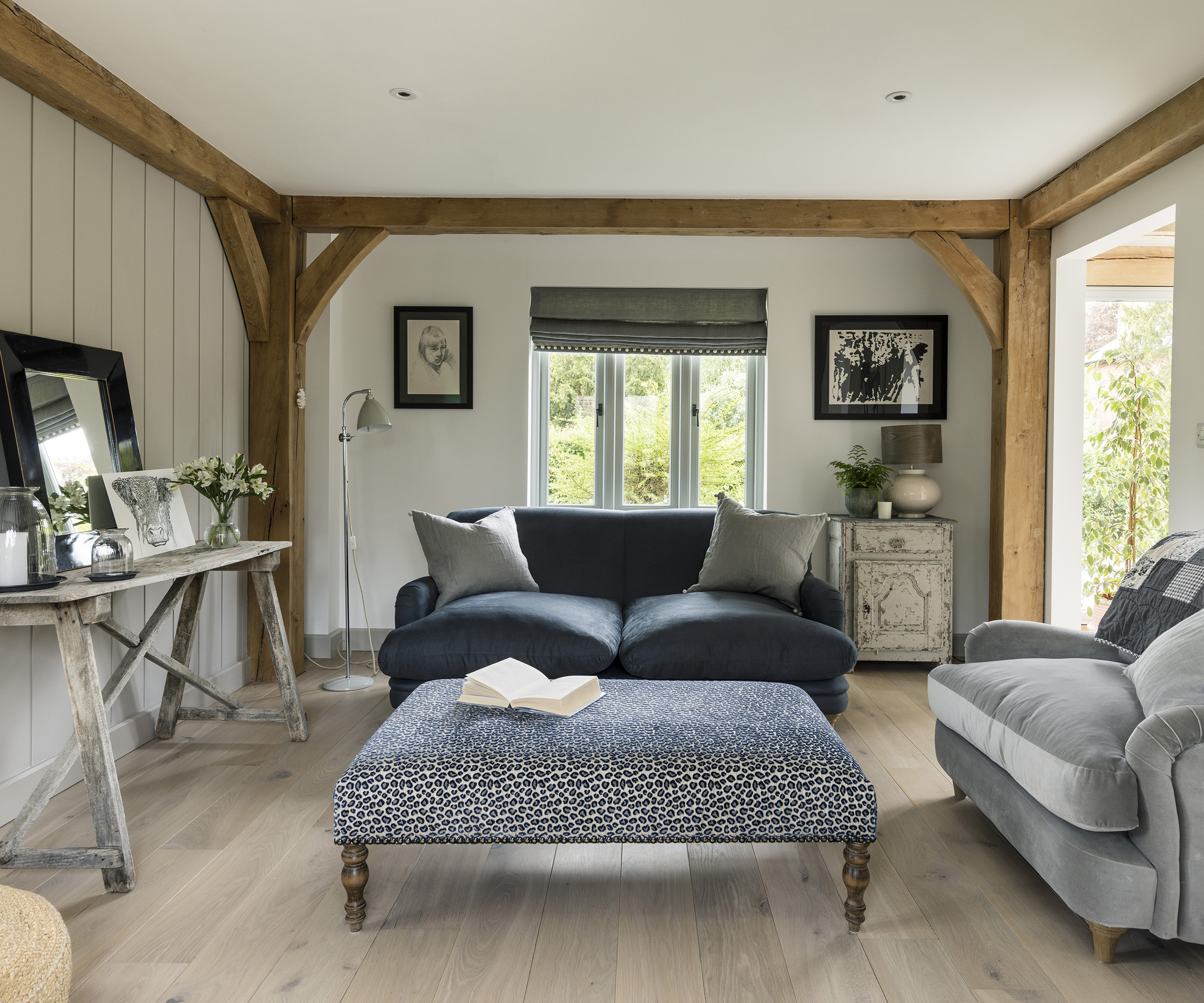 Rustic living room with neutral palette and exposed oak beams