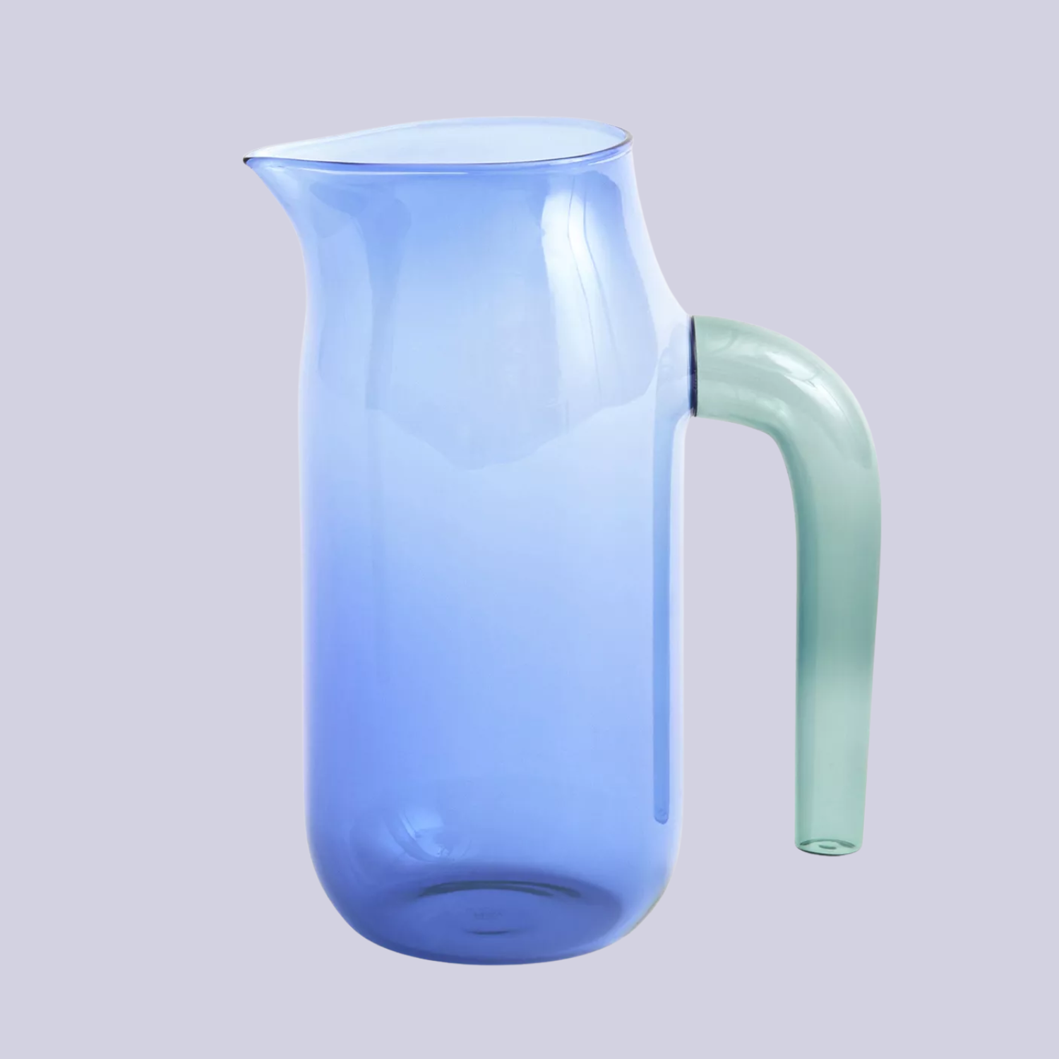 A blue glass jug with a sea green handle