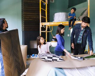 Brian Patrick Flynn and clients renovating a room