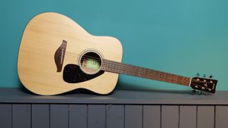 Yamaha FG800 against a blue wall in our photo studio