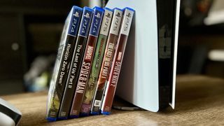 PS5 games leaning against a PS5 Pro