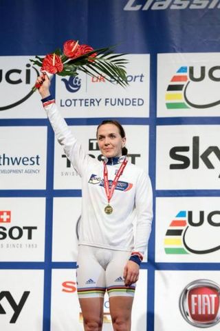 Victoria Pendleton stands proudly on the podium after she collected the World Cup leader's jersey and gold medal for the women's sprint at the Manchester World Cup.