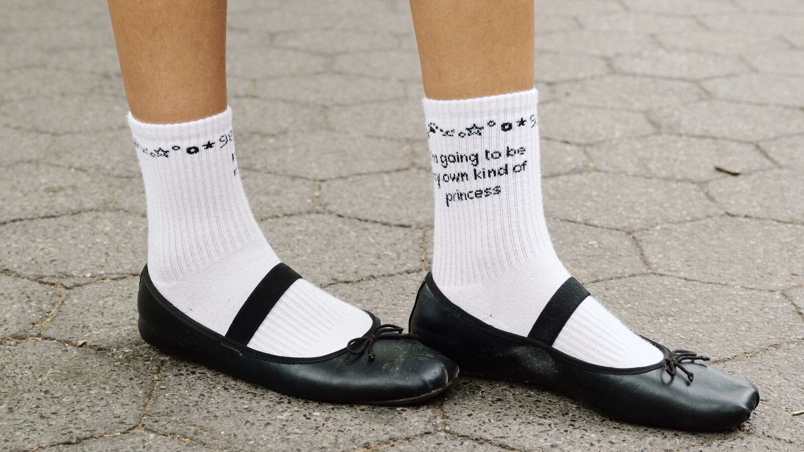 Black ballet flats worn with white socks.