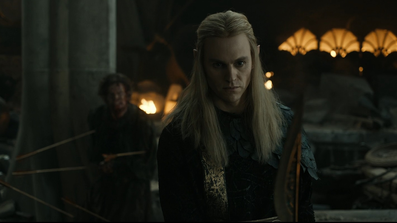 Sauron scowls as he faces the camera with a bloodied Celebrimbor behind him in The Rings of Power season 2 finale