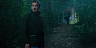 Pet Sematary Jason Clarke heading into the woods with a shovel