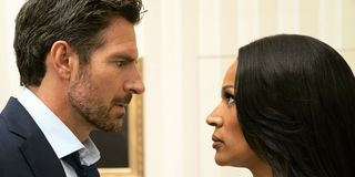 Ed Quinn and Kron Moore staring each other down as Mr. & Mrs. Franklin in Tyler Perry's The Oval