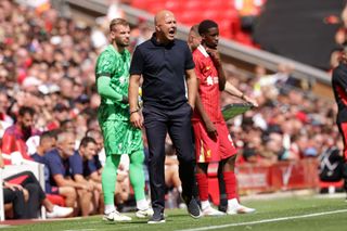 LIVERPOOL, ENGLAND - AUGUST 11: Liverpool manager Arne Slot shouts on his team during the Pre-Season Friendly between Liverpool and Sevilla, at Anfield on August 11, 2024 in Liverpool, England. (Photo by Barrington Coombs/Getty Images)