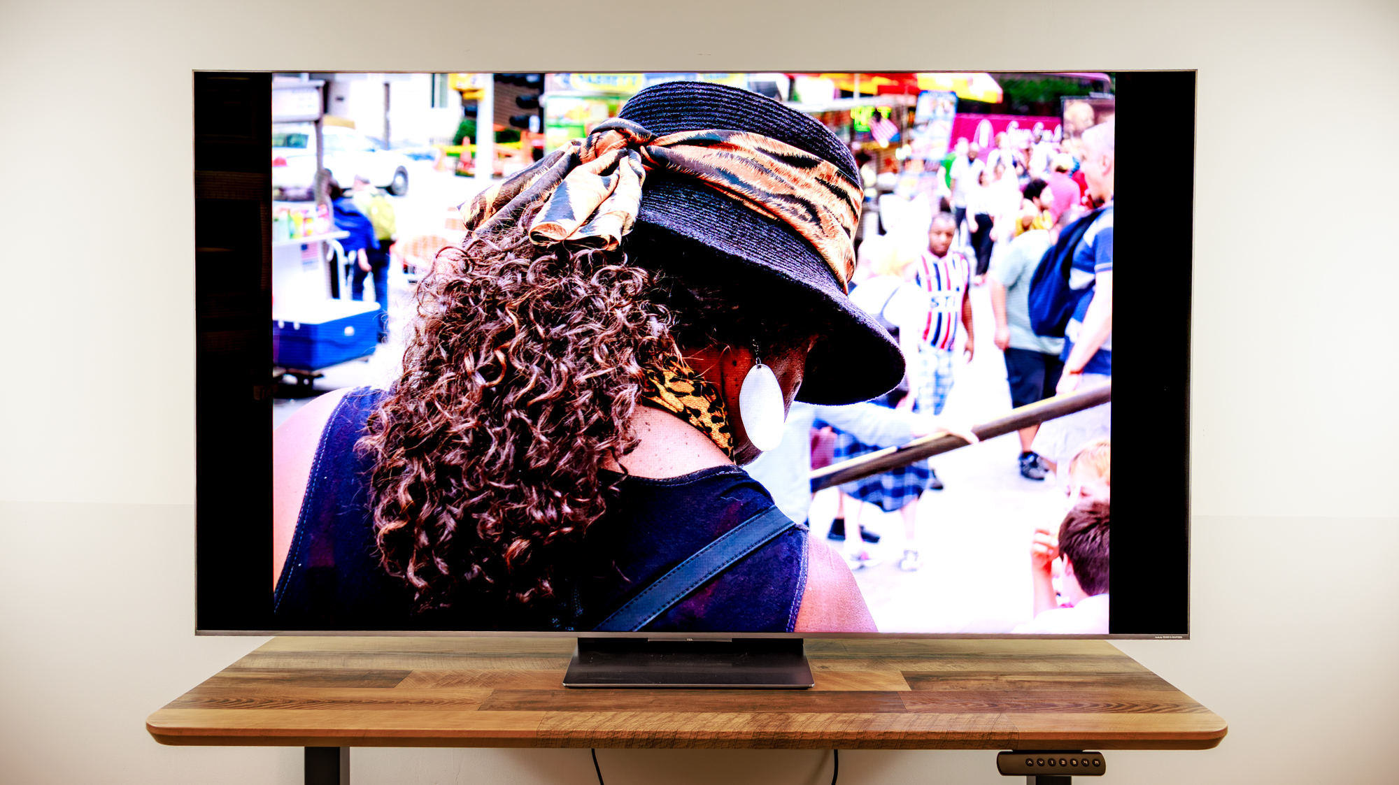 A TCL QM8L TV on a desk